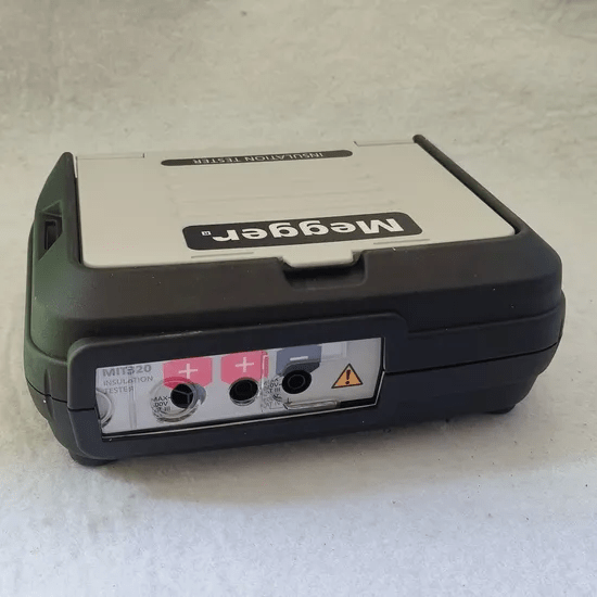 Closeup of MEGGER MIT320 insulation tester test leads connection area with front cover closed