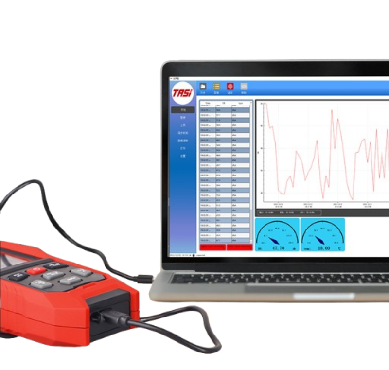 Red diagnostic tool connected to a laptop displaying software with data graphs on a white background