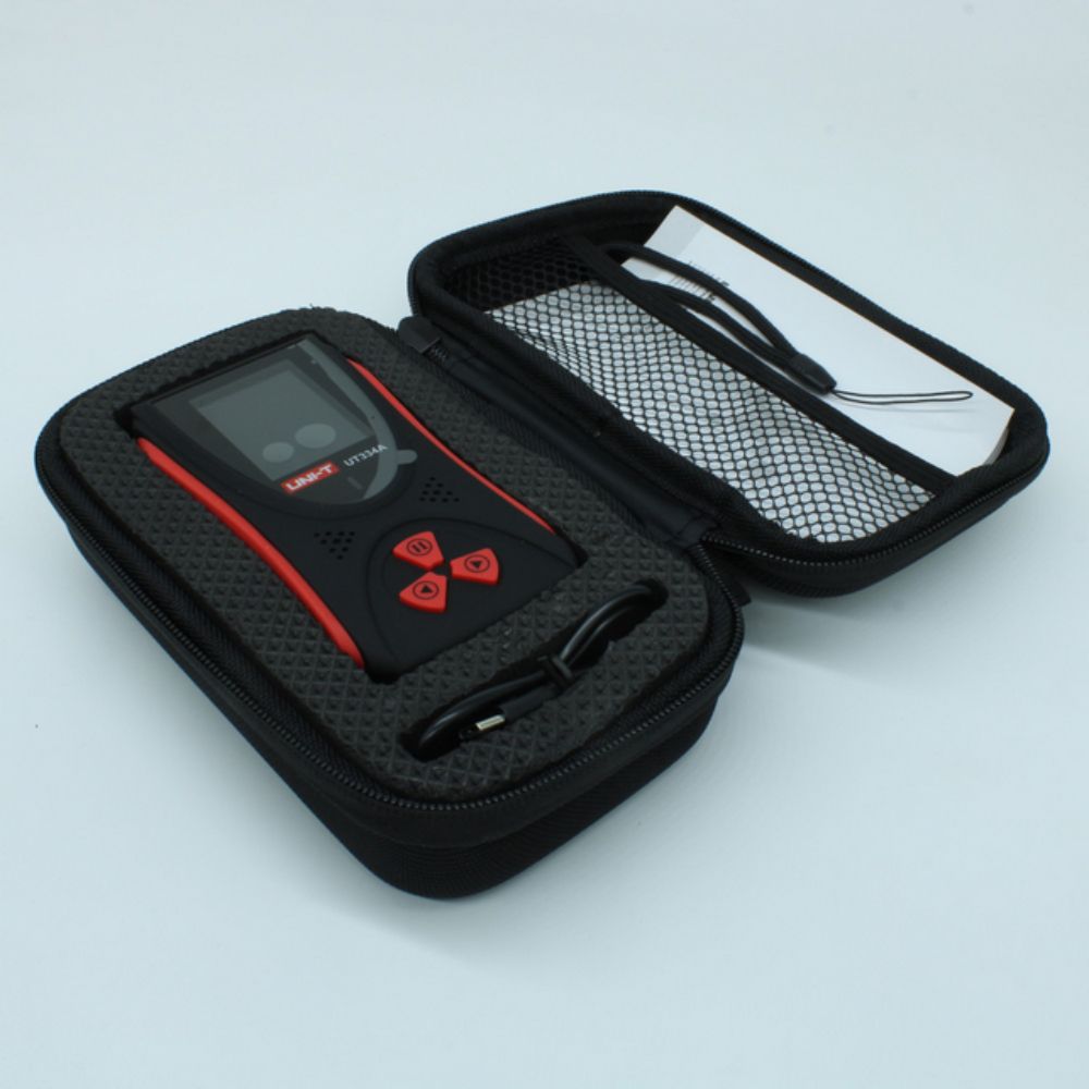 UNI-T UT334A Radiation Meter neatly organized in its portable carrying pouch with charging cable and strap for field inspections across the island.
