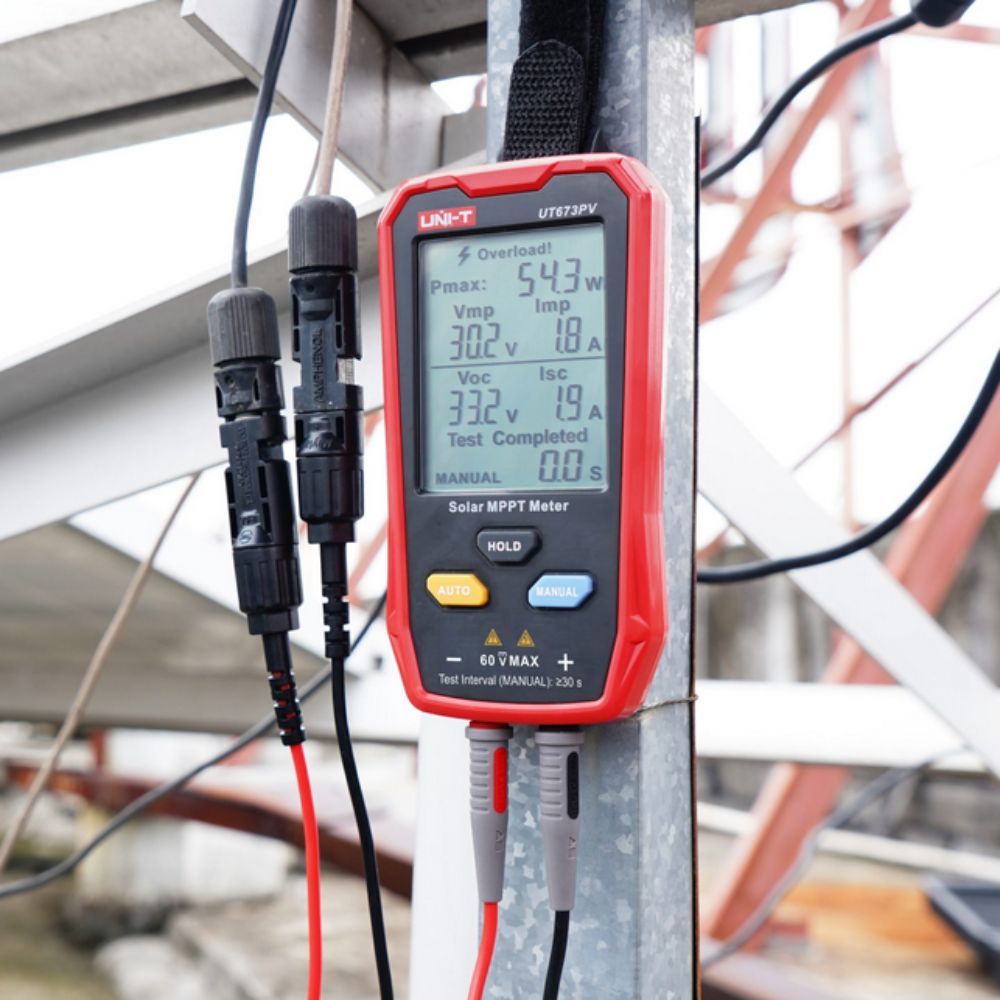 UNI-T UT673PV Solar Panel Health Monitor mounted for hands-free testing, displaying 54.3W Pmax during a maintenance check on a mounting structure.