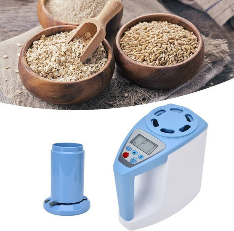 Digital kitchen scale with a blue and white design on a white background, with wooden bowls of oats and paddy in the top left corner.