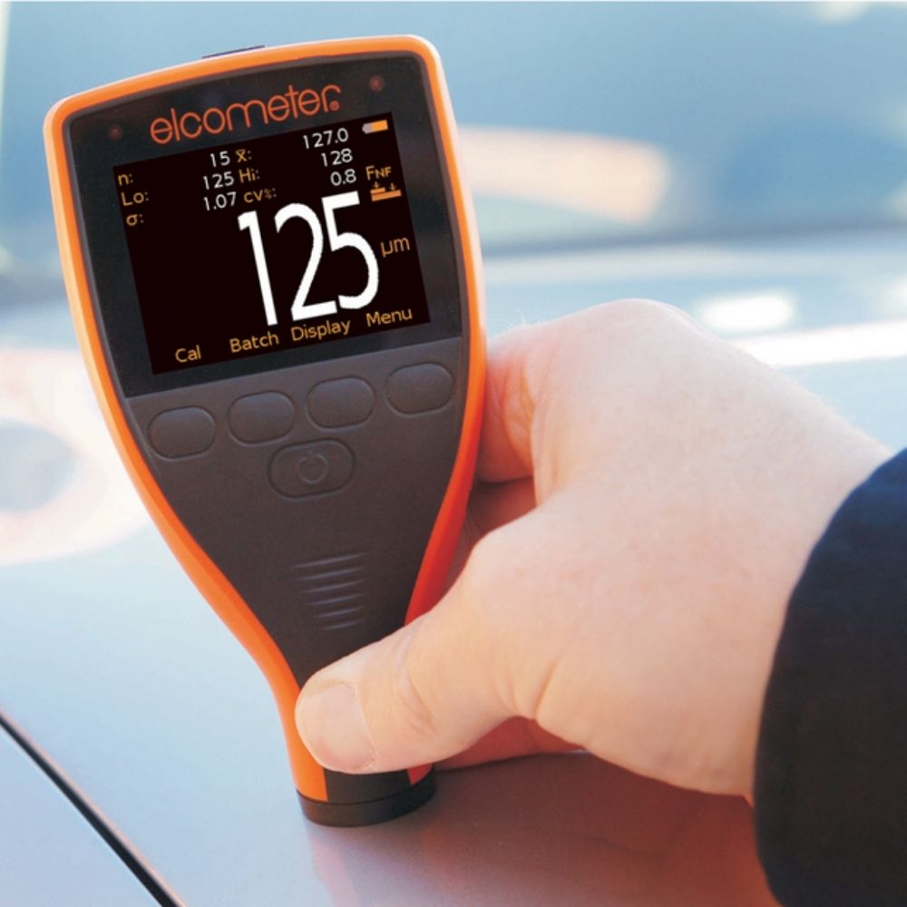 Elcometer 456 Separate Coating Thickness Gauge checking car body paint thickness, automotive paint thickness meter reading 125 µm for used vehicle inspection in Sri Lanka.