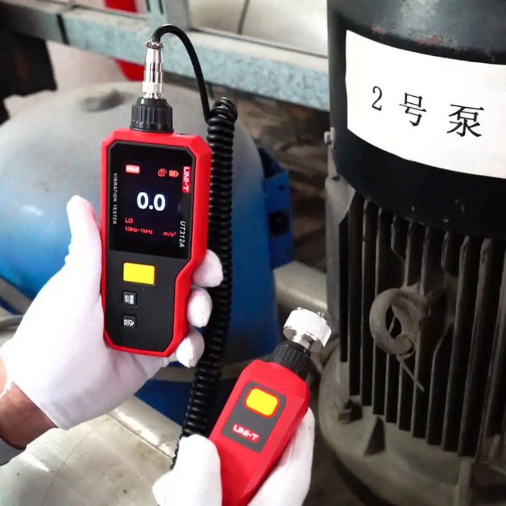 Electric motor vibration testing using the UNI-T UT312A handheld tester equipped with a magnetic probe for reliable, hands-free condition monitoring.