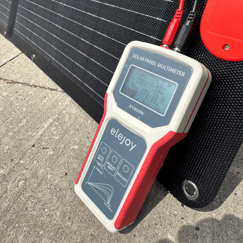 ELEJOY EY800W Solar Panel Tester connected to photovoltaic module displaying P.max 209.2W and VOC 23.28V - real-time MPPT power testing for solar panel commissioning and troubleshooting