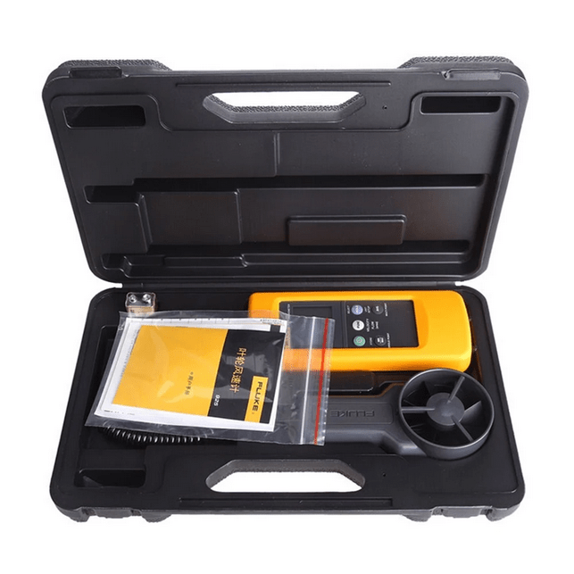 The complete FLUKE 925 anemometer kit, including the main unit, vane probe, and manual, all neatly arranged inside the open hard carrying case.