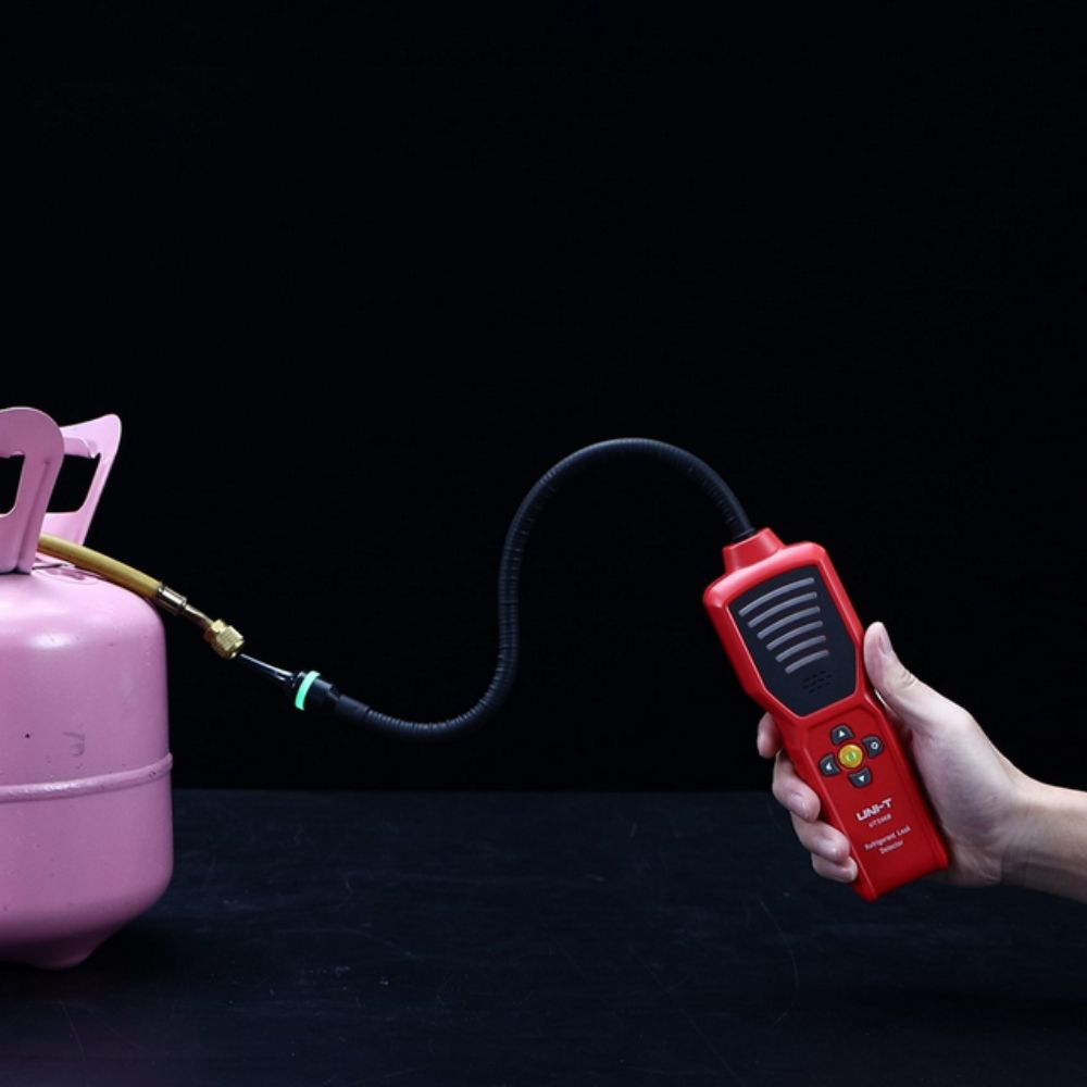 High-sensitivity refrigerant leak sniffer inspecting a Freon filling canister for micro-leaks to ensure secure storage and environmental safety.
