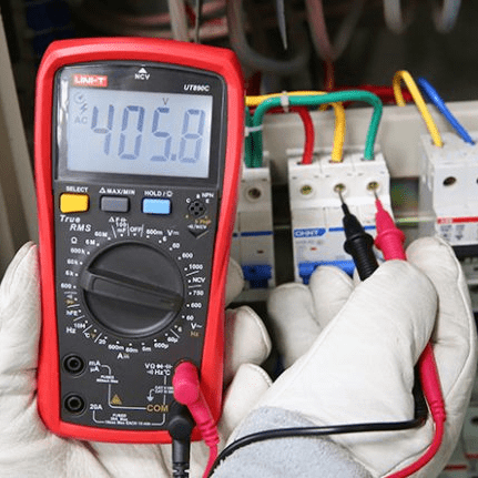 Measuring Control Panel Voltage with UNI-T UT890C - Industrial Troubleshooting Application - True RMS Meter Displaying 405.8V on 600V Range - 3-Phase Power System Testing