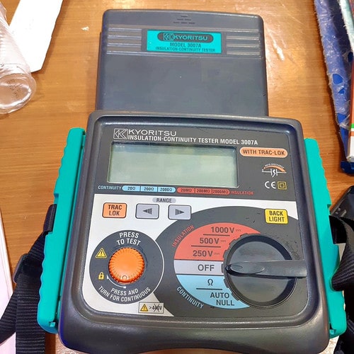 Close-up view of the KYORITSU 3005A insulation tester's front control panel and operation buttons.