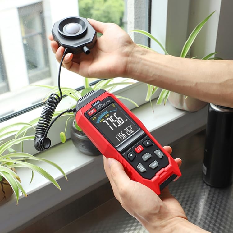 Measuring indoor ambient light for a potted plant using the TASI TA632B lux meter, with the wired sensor probe providing a precise reading of 775.6 lux.