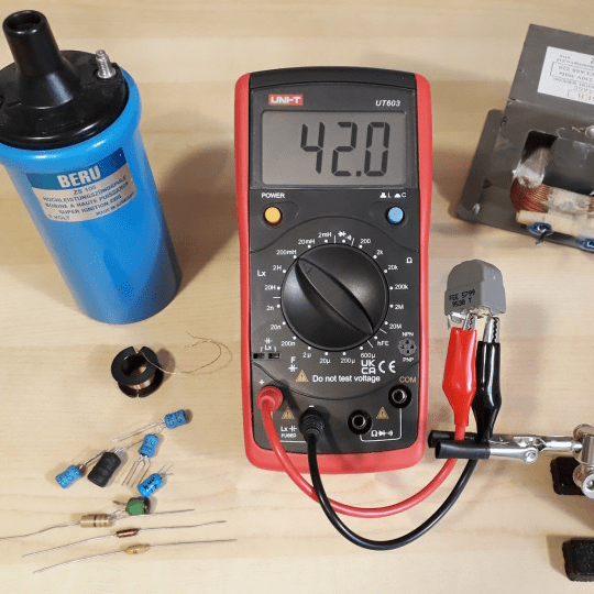 Measuring Inductance with UNI-T UT603 Henry Meter - Testing Motor Coils and Transformer Windings - Digital Display Showing 42.0mH on 200mH Range - Inductive Load Troubleshooting