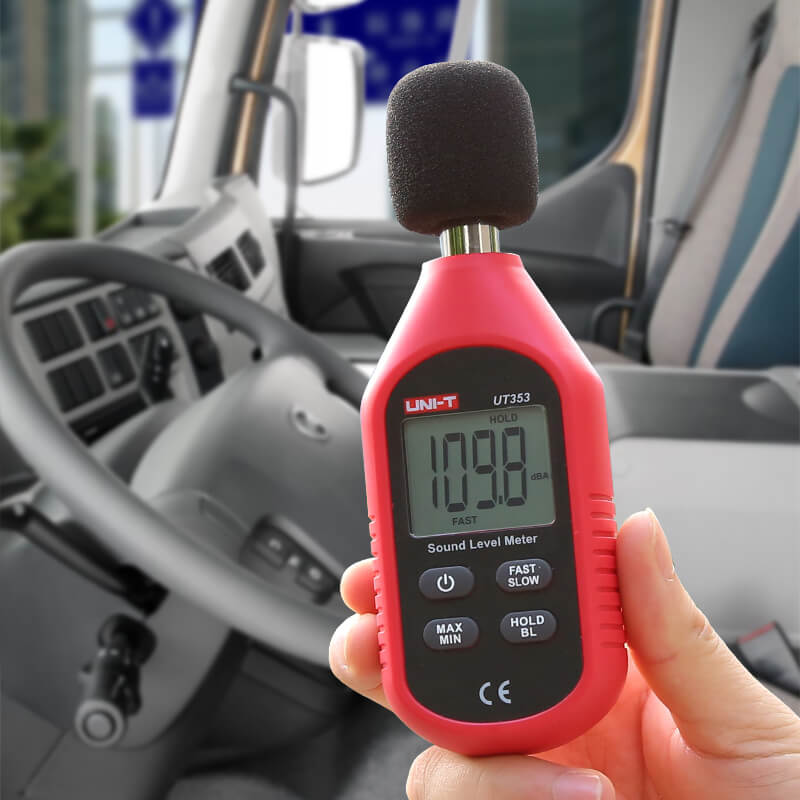 Using the UNI-T UT353 to measure high-decibel noise inside a truck cabin for occupational safety assessment, with a reading of 109.8 dBA.