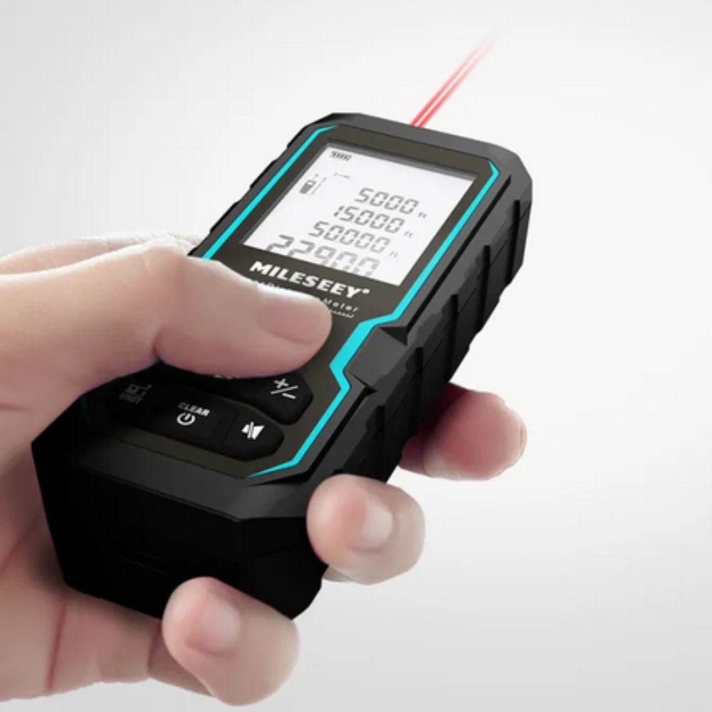 Mileseey S6 digital laser distance meter actively measuring room distance during a construction site inspection