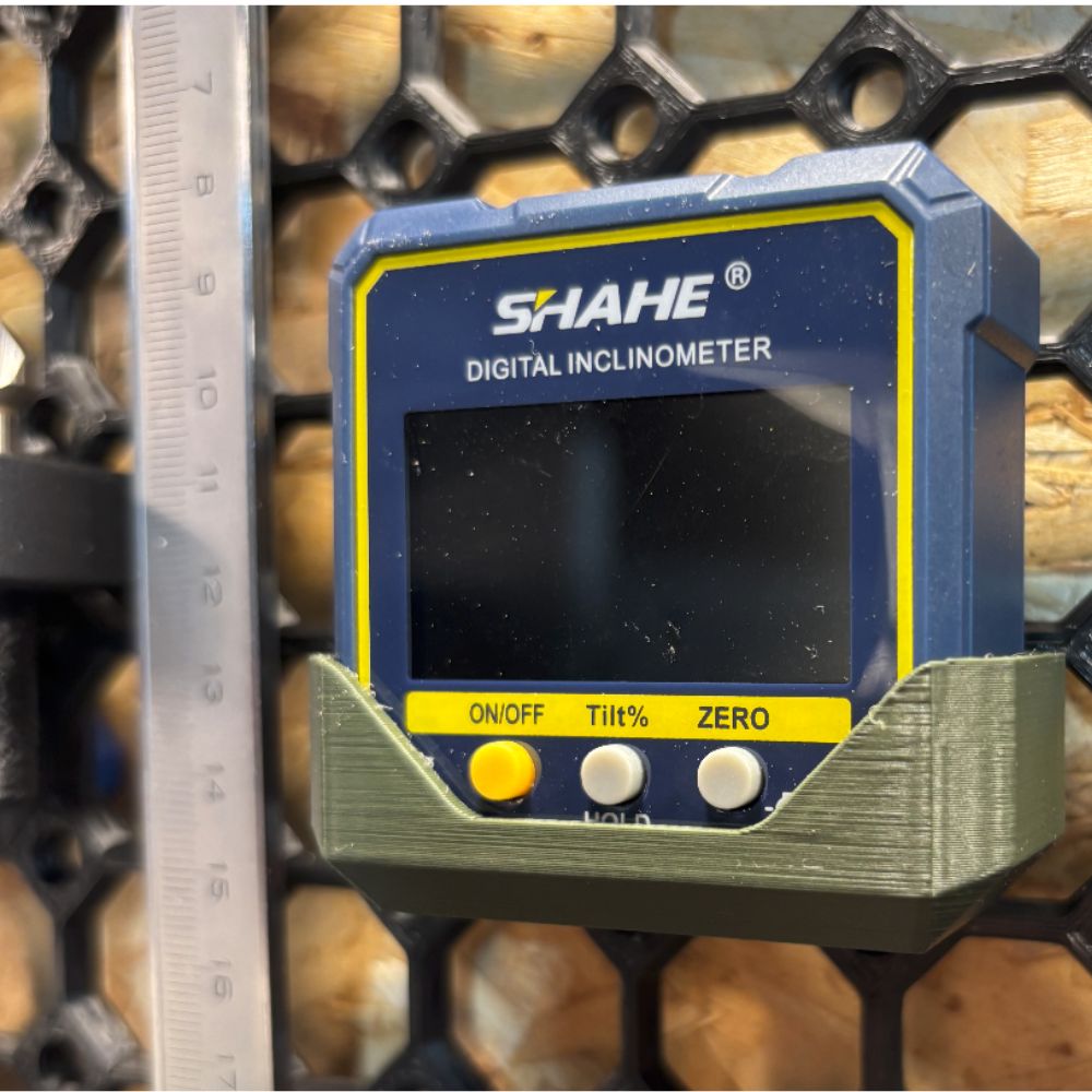 SHAHE 5315-90C pocket digital level and inclinometer in custom 3D printed holder on workbench for workshop calibration and tool setup