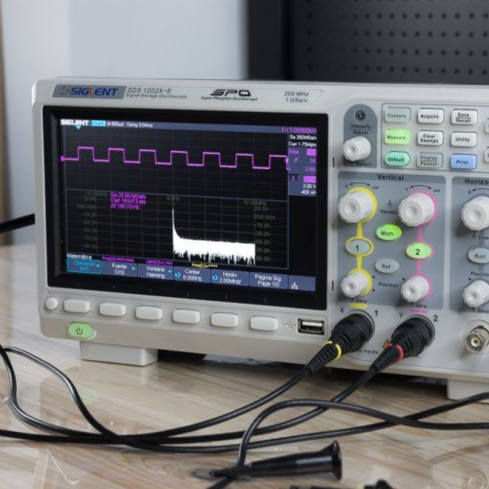SIGLENT SDS1202X-E 200MHz 2 Channel Digital Oscilloscope in operation showing live waveform display with dual channel signals, measurement cursors and serial decode analysis - Professional testing electronics engineering Sri Lanka.