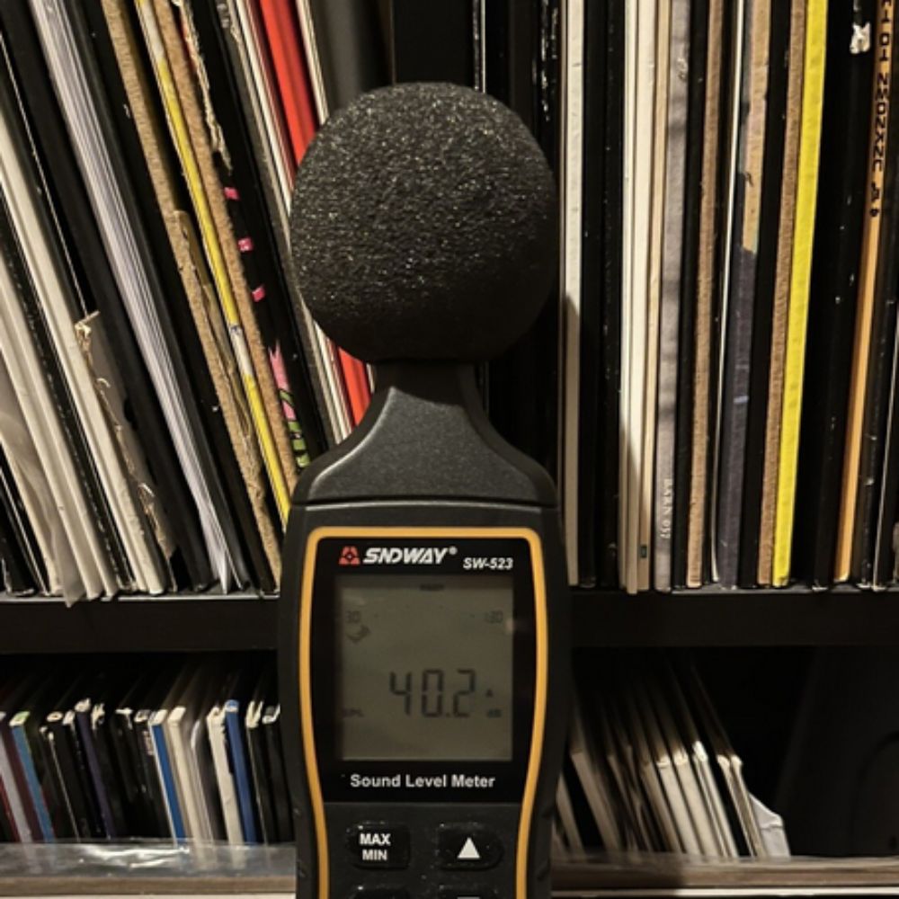 SNDWAY SW-524 sound level meter measuring indoor noise levels inside a library
