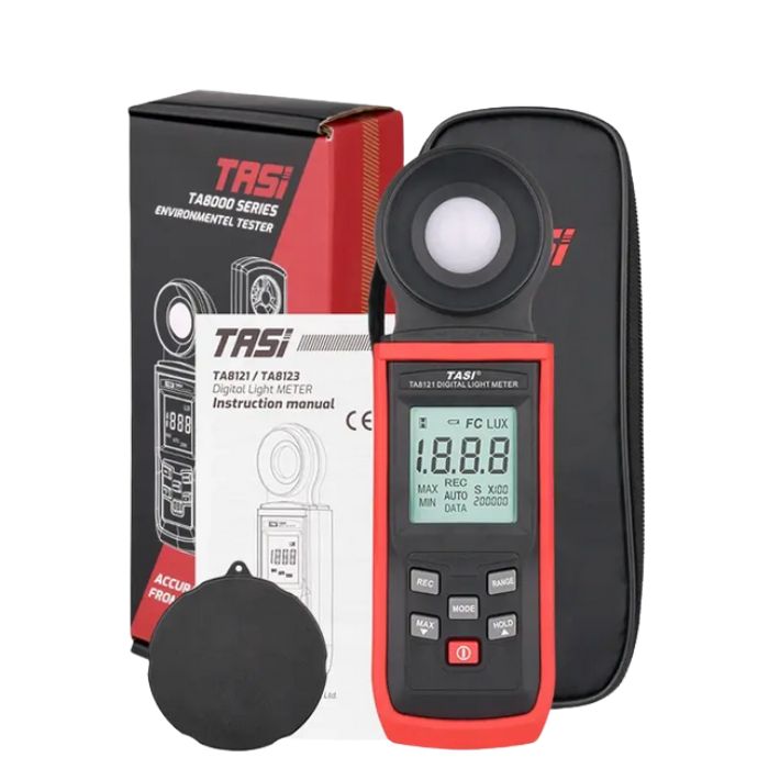 Complete package contents of the TASI TA8121 lux meter, showing the device, user manual, pouch, and retail box.