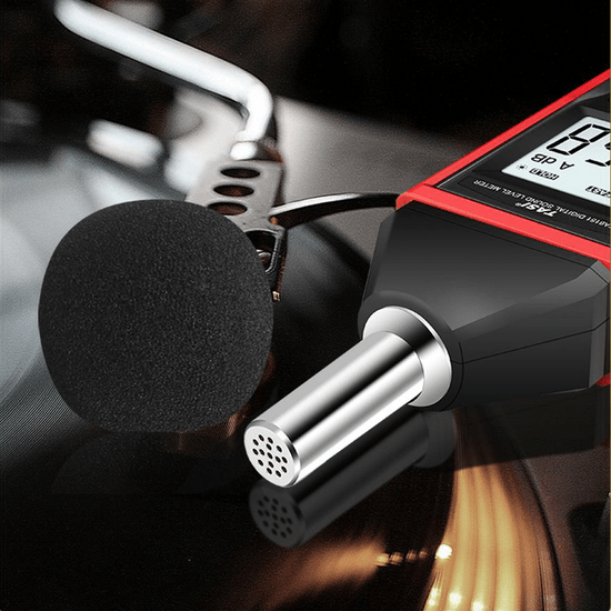 A close-up view of the TASI TA8151 decibel meter's sensitive condenser microphone with the protective foam windscreen removed.