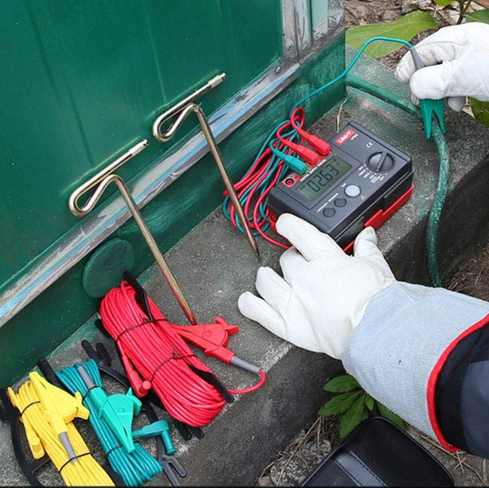 A technician using the UNI-T UT521 for an electrical safety test, demonstrating the simple setup for accurate earth resistance measurement in the field.