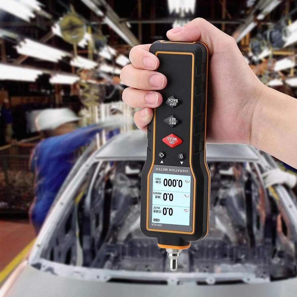 Technician using the SNDWAY SW-65A multi-channel vibration meter to perform engine diagnostics and unbalance testing on an automobile.