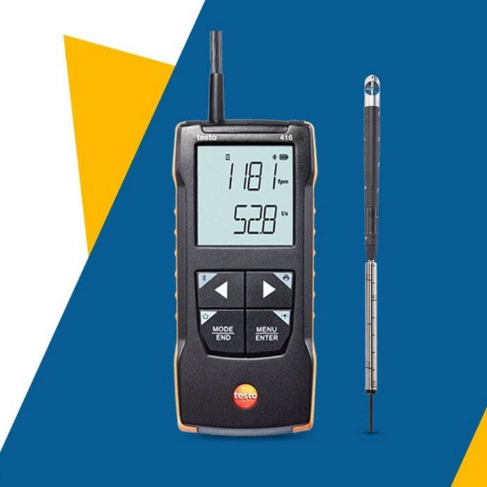 The TESTO 425 thermal anemometer with its bright, backlit display, placed next to its slim, telescopic hot-wire probe for in-duct air velocity readings.