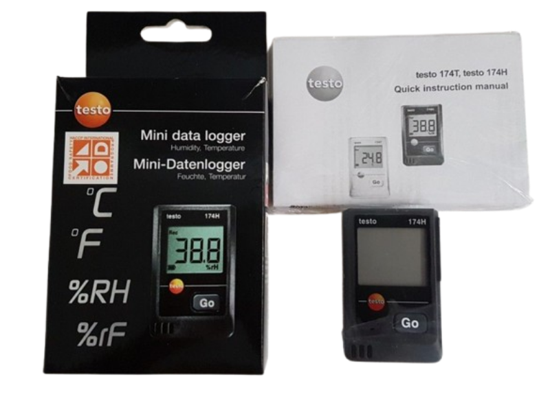 Testo mini data logger with packaging and manual on a white background