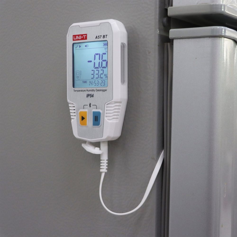 UNI-T A57 BT Bluetooth data logger mounted inside a refrigerator for cold storage humidity and temperature monitoring with IP54 protection