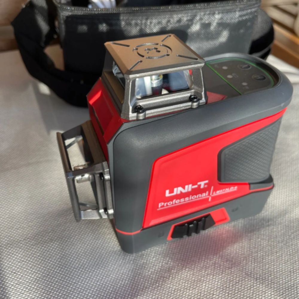 UNI-T LM575LD-e 12-Line 3D Laser Level with Remote Control mounted and powered on, ready for self-leveling