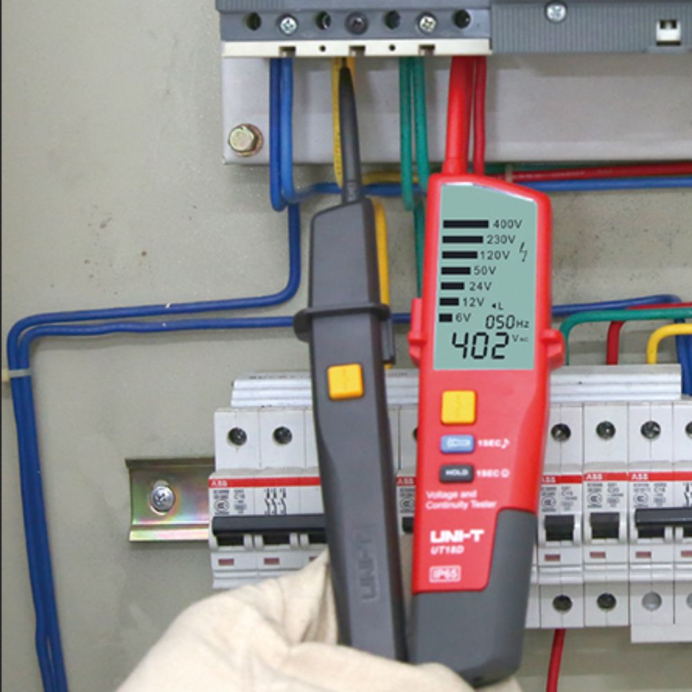 UNI-T UT18D digital ac dc voltage continuity tester safely measuring electrical current and checking circuits on an MCB distribution board railing.