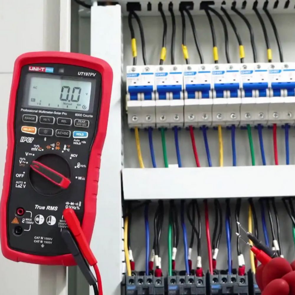 UNI-T UT197PV Solar Pro Professional Multimeter measuring current and voltage on industrial electricity supply panel - CAT IV 1000V safety rated for power distribution testing Sri Lanka.