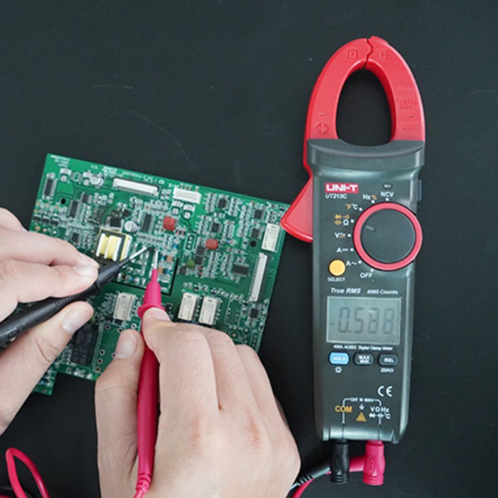 UNI-T UT213C True RMS clamp meter testing current in small electronic circuits – PCB troubleshooting, low current measurement, component testing for electronics repair Sri Lanka.