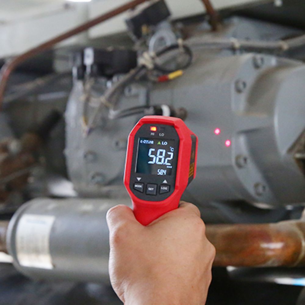 UNI-T UT309C laser infrared thermometer performing non-contact turbocharged engine temperature measurement