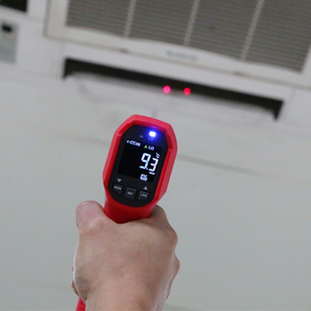 UNI-T UT309E industrial infrared thermometer performing scheduled HVAC system temperature inspection and data logging