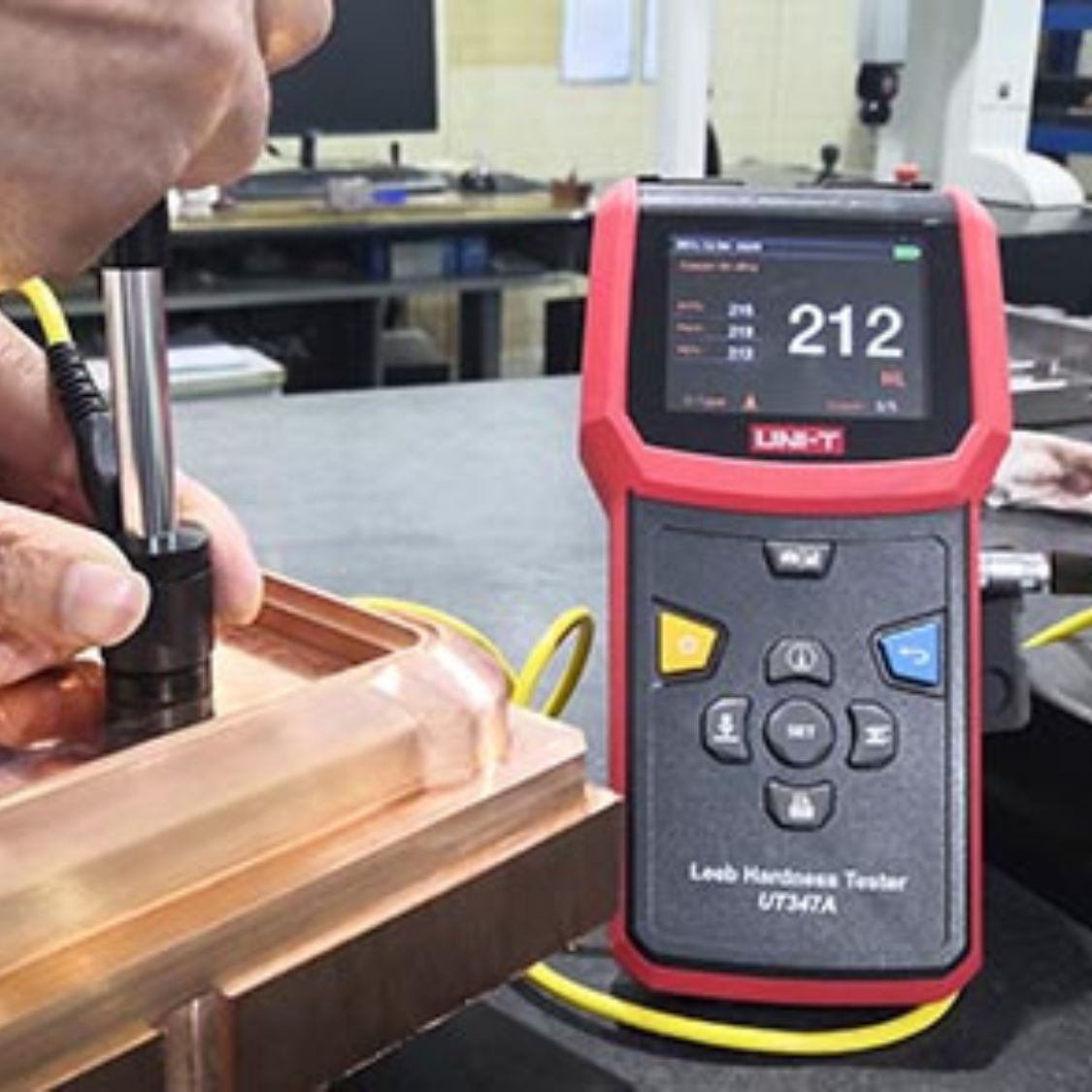 UNI-T UT347A Leeb Hardness Tester performing non-destructive testing on manufacturing plant metal parts and components - HL HB HRC HRB HV HS scale verification quality control Sri Lanka.