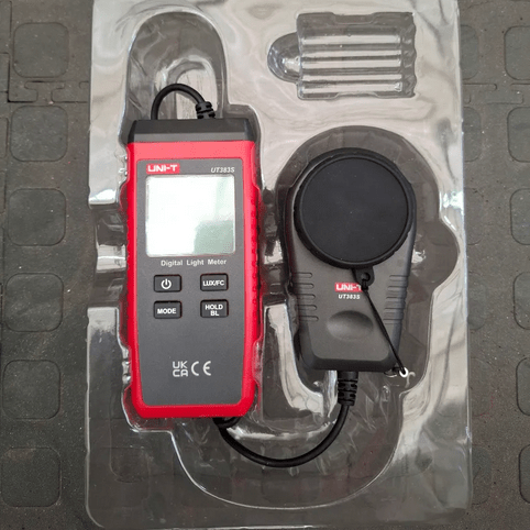 The UNI-T UT383S light meter with data logging capabilities securely placed inside its protective blister packaging.