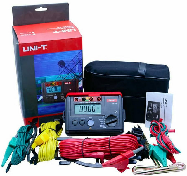Complete UNI-T UT521 earth resistance tester kit, including the meter, earth spikes, test leads, carrying case, and retail box for professional use.