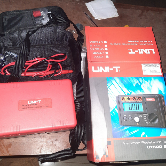 The professional UNI-T UT522 earth tester kit with its protective front cover, durable carrying case, and official retail box, ready for field use.