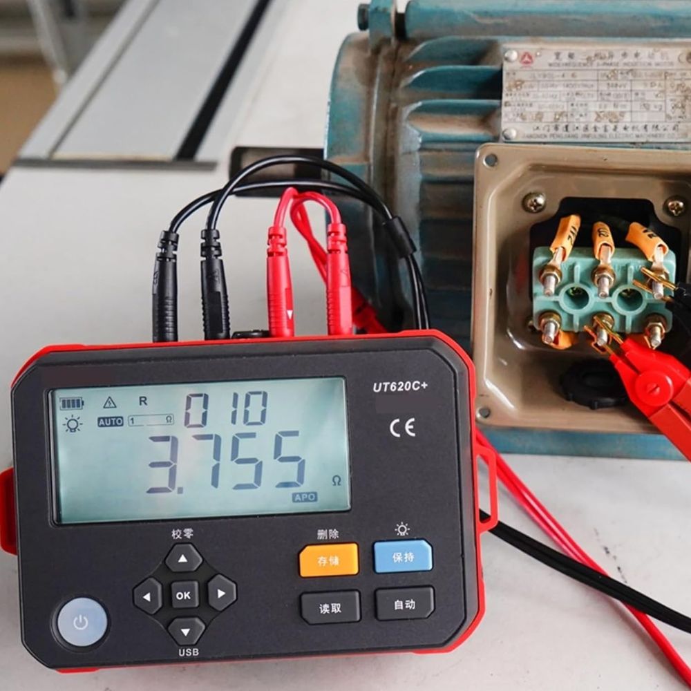 UNI-T UT620C+ DC low resistance tester measuring winding resistance in three-phase motor wiring.