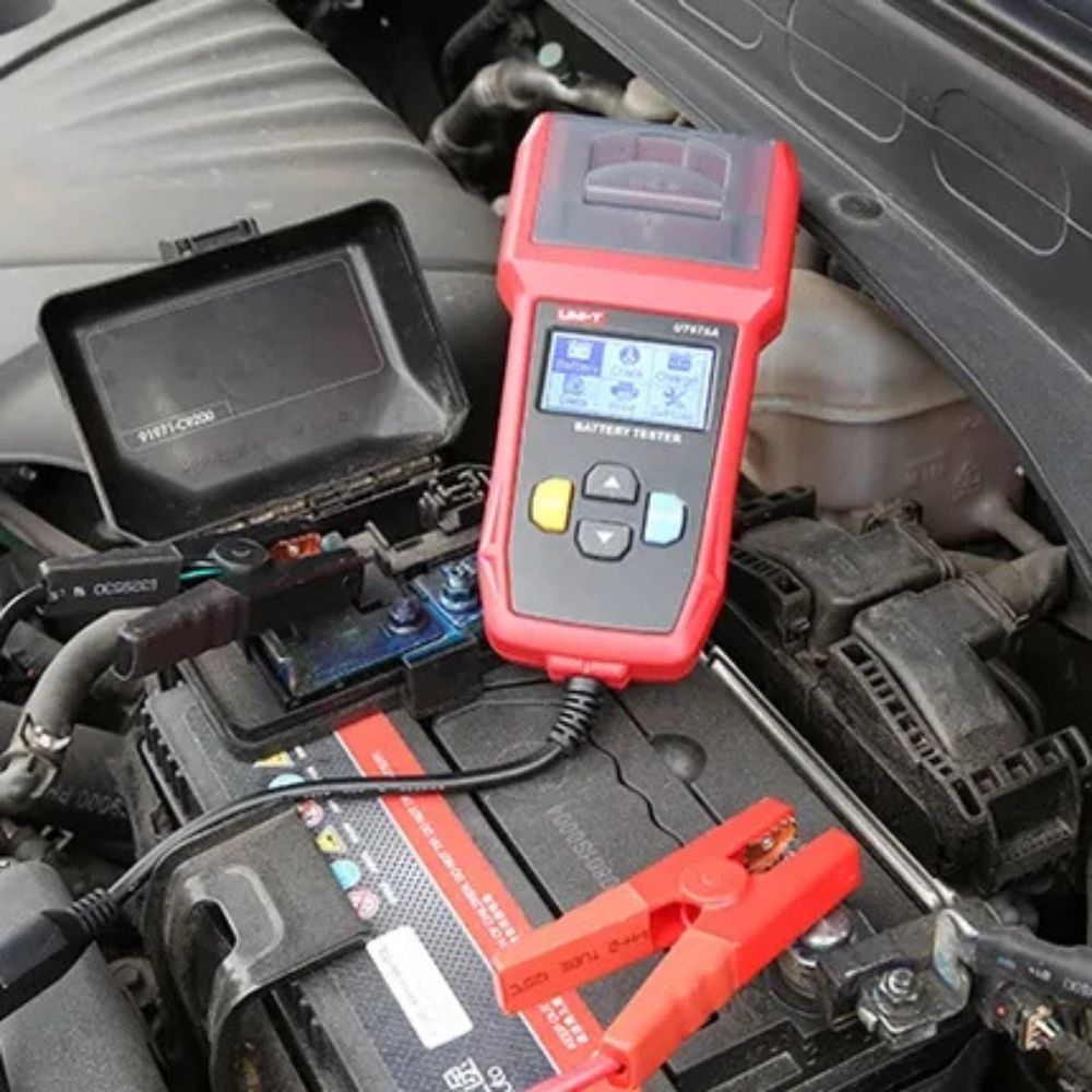 UNI-T UT675A battery tester being used to test a car battery
