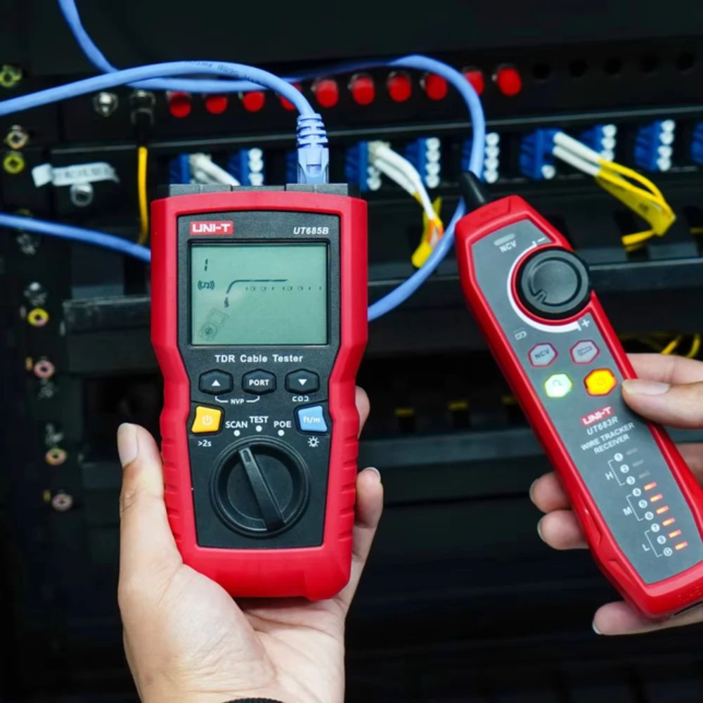 Technician using UNI-T UT685B KIT TDR cable tester to diagnose network cabling near a server rack