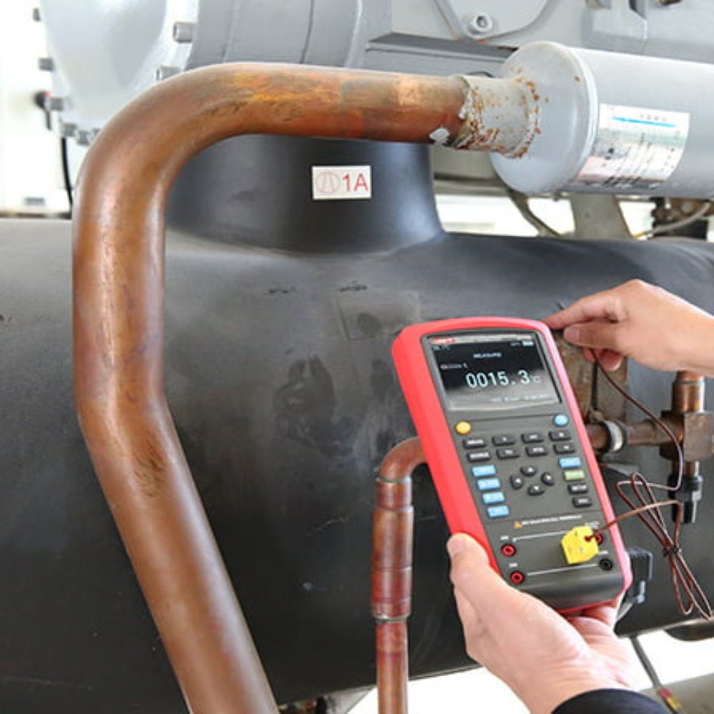 UNI-T UT714 performing temperature calibration in an industrial process setting, used to test and calibrate temperature instruments such as sensors and transmitters.