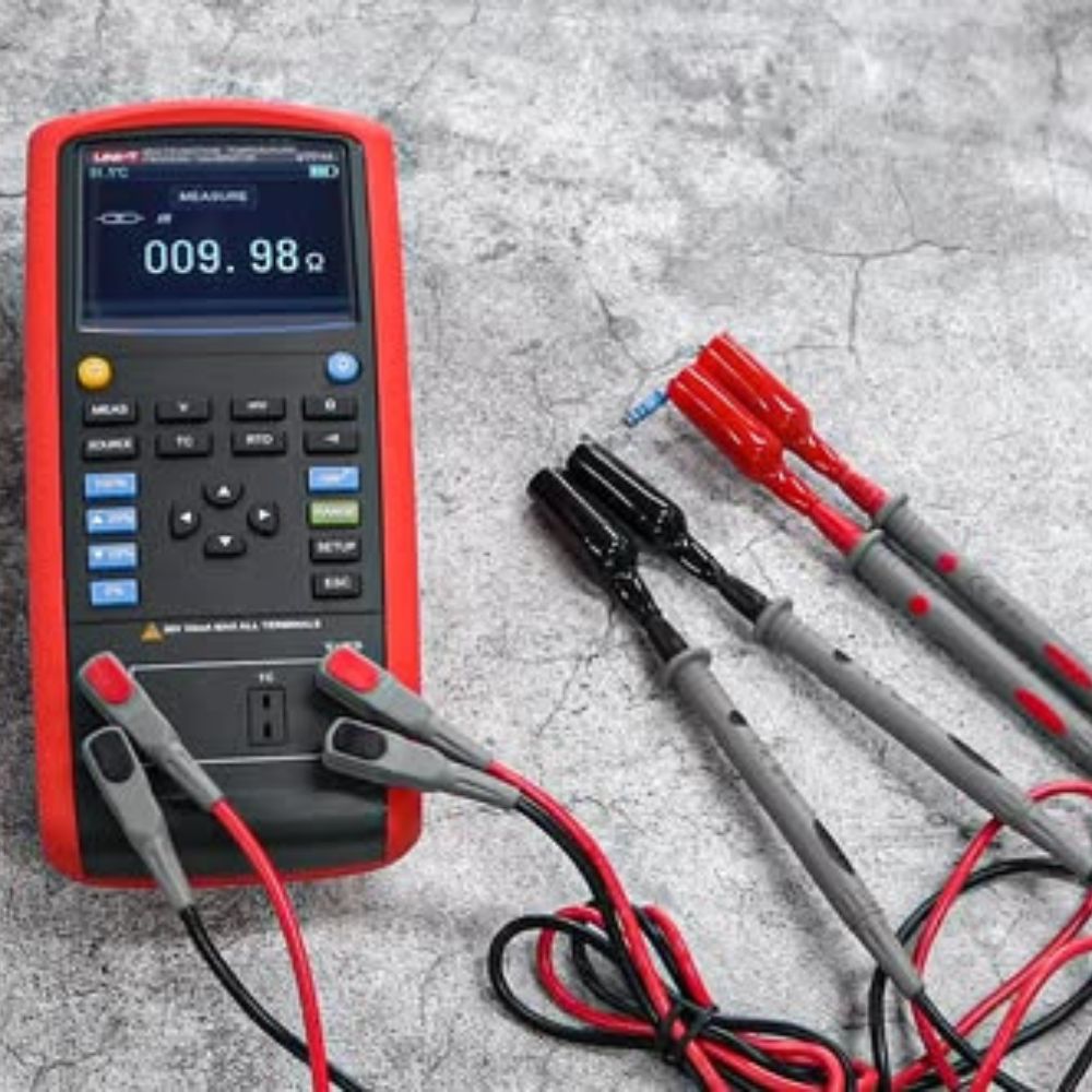 UNI-T UT715 loop process calibrator with test leads connected, ready to source and measure 4–20 mA loop current and simulate process transmitters.