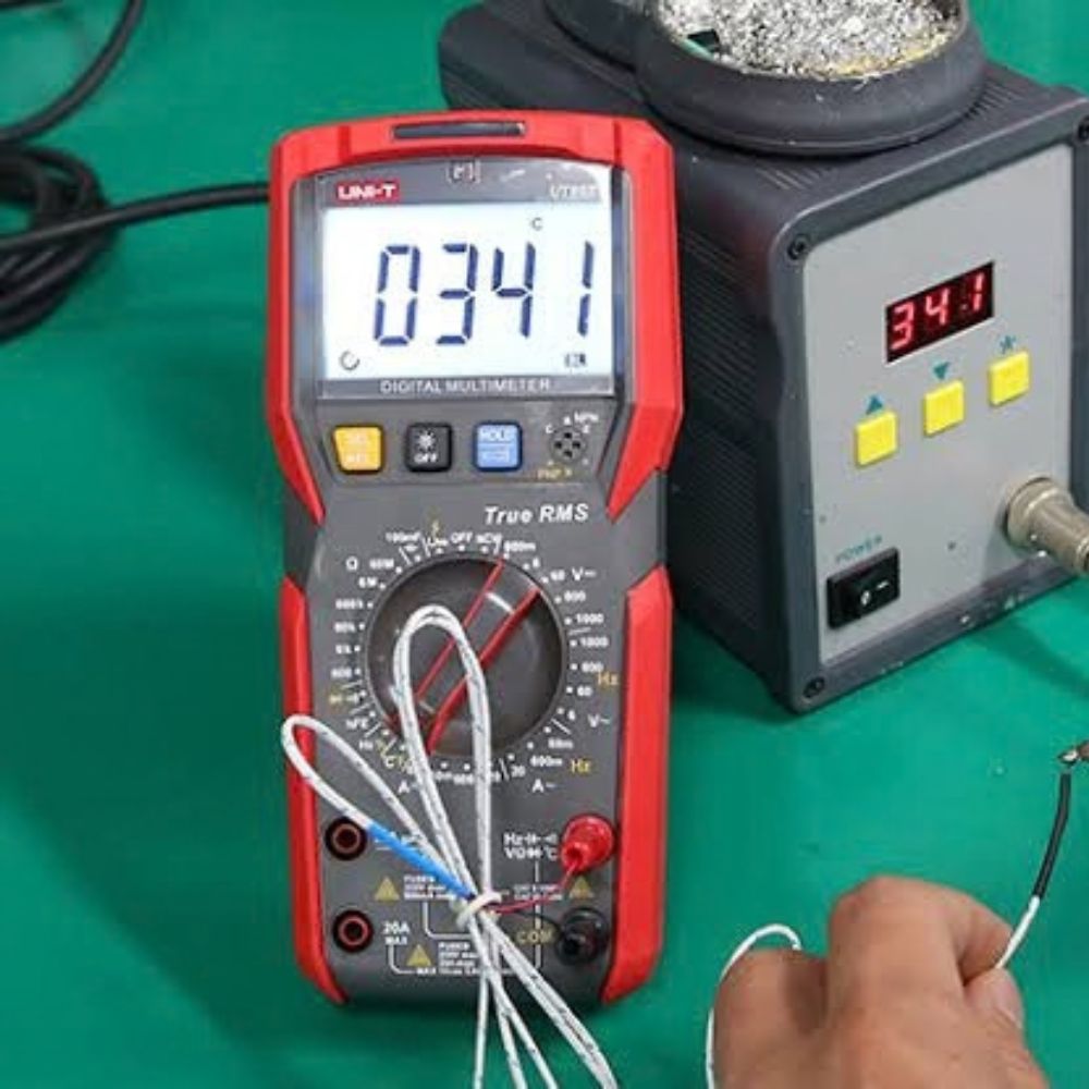 UNI-T UT89XD Digital Multimeter checking soldering iron temperature with K-type probe