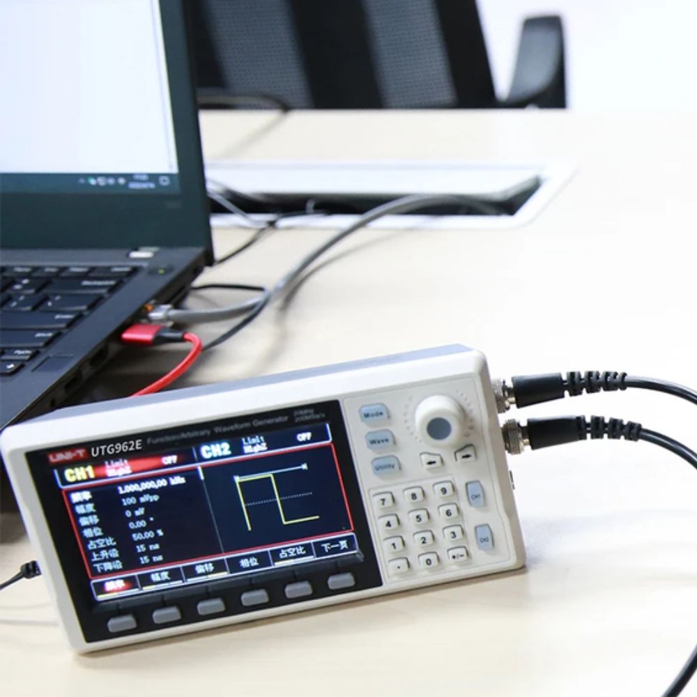 UNI-T UTG962E 60MHz waveform generator connected to a PC via USB while generating a test waveform for electronics circuit testing.