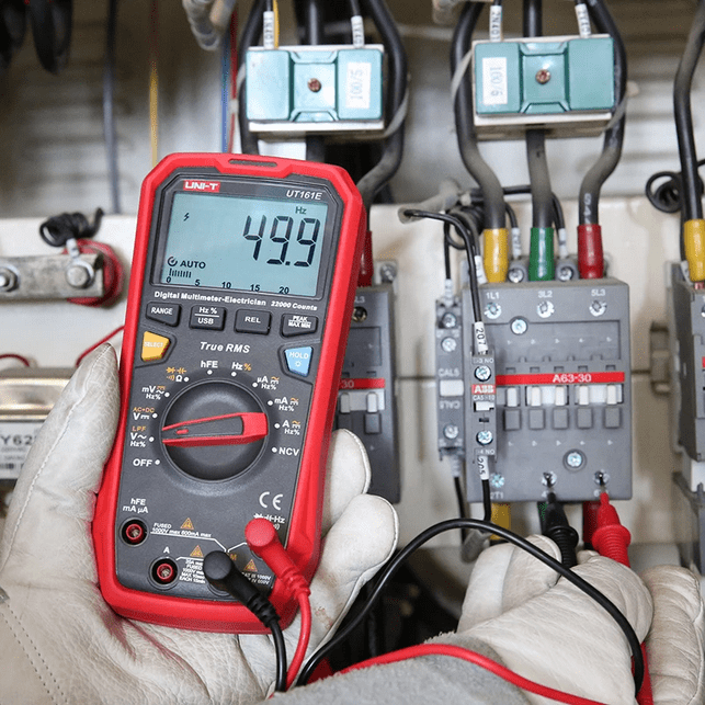 UNI-T UT161E measuring 49.9Hz frequency on variable frequency drive (VFD) control panel using LPF mode for accurate motor drive diagnostics and inverter maintenance.