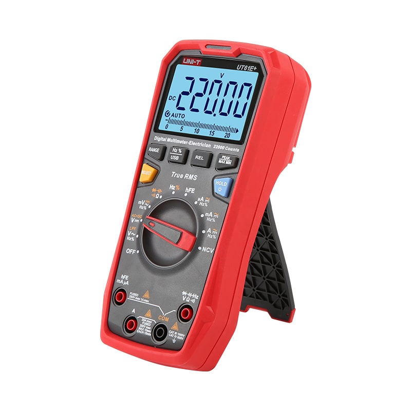 Side profile of UNI-T UT61E+ auto-ranging multimeter showing 220V DC reading, highlighting ergonomic design and durable build quality for benchtop electronics repair.