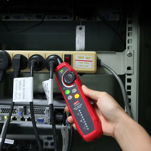 UT683R receiver in Non-Contact Voltage (NCV) mode testing a power outlet near a network rack, demonstrating safety voltage detection feature for electrical maintenance.